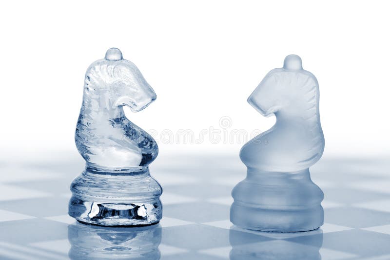 Two glass chess horses.