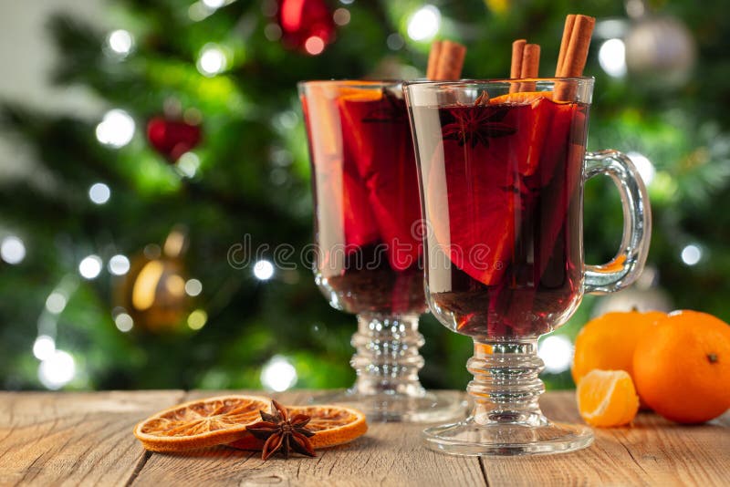 Two Glass of Christmas Mulled Wine or Gluhwein with Spices and Orange  Slices on Rustic Table Against the Christmas Tree. Stock Photo - Image of  mandarins, evening: 135961860