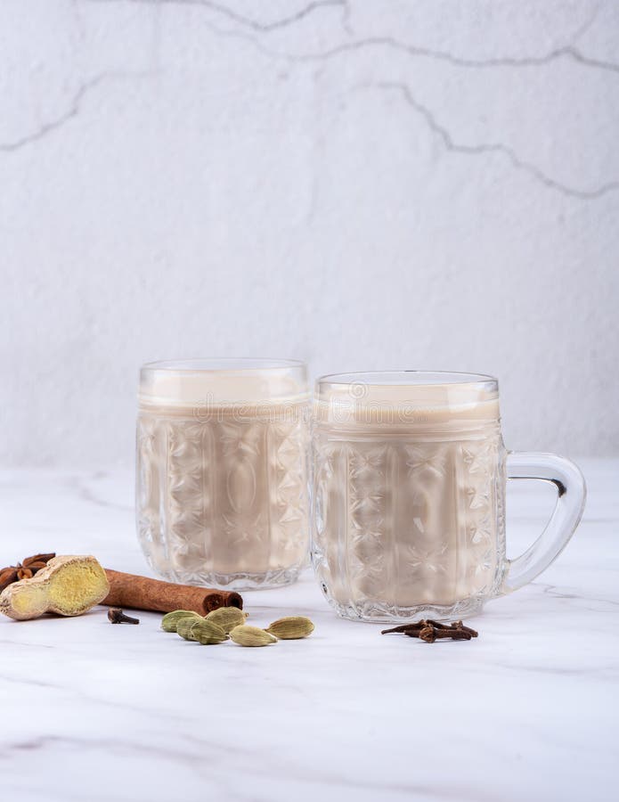 Two Mugs of Masala Tea. Hot Indian Masala Chai Tea with Milk and Spices