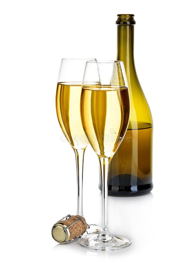 Two glasses of champagne on the background of brown bottles close-up isolated on a white. Festive still life.