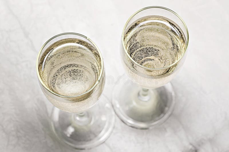 Two glasses of champagne in a close-up top view