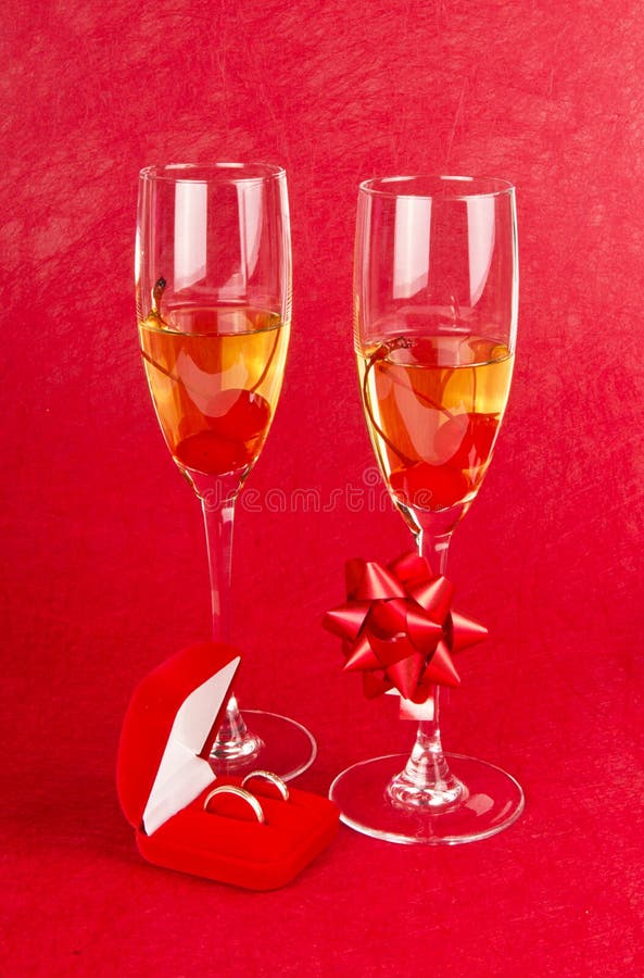 Two Glasses with Champagne and Jewelry Box on Red Stock Image Image