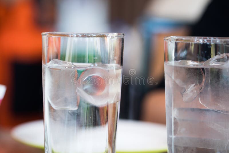 Two glasses cold water. Selective focus stock photo