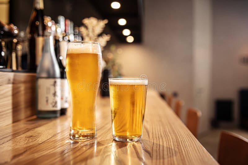 Two Glasses of Japanese Light Beer on a Bar Desk Stock Photo Image of