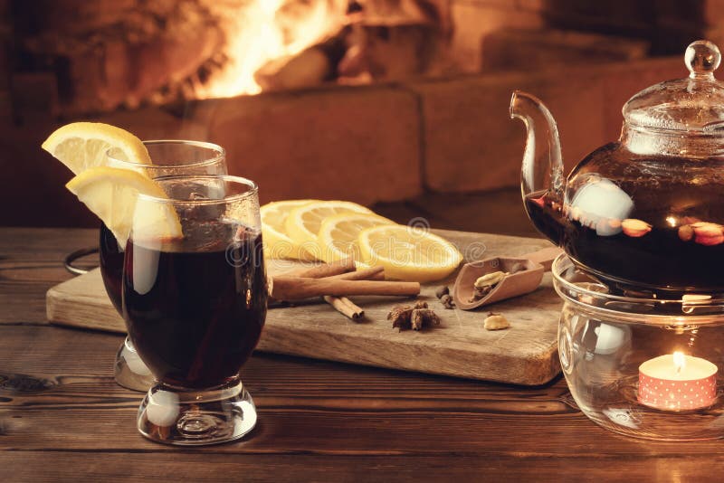 https://thumbs.dreamstime.com/b/two-glasses-mulled-wine-teapot-wooden-table-front-burning-fireplace-162893570.jpg