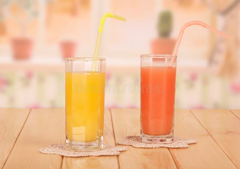 Two glasses with orange and grapefruit juice