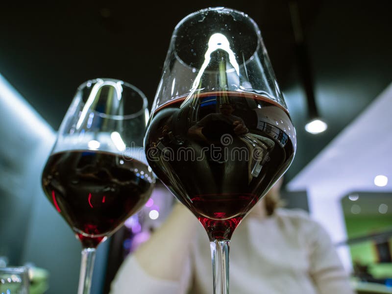 Two Glasses Of Red Organic Wine Shared With Male Female
