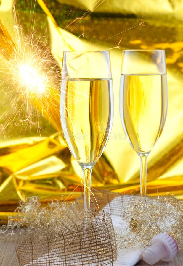 Two glasses of sparkling wine with sparkler