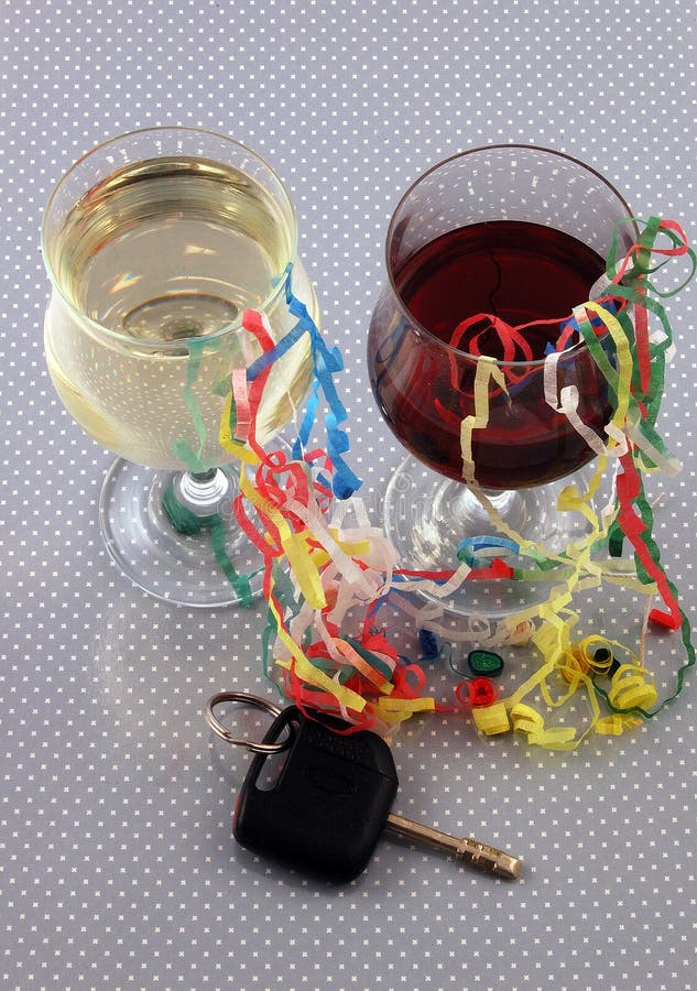 Two glasses of wine and some car keys stock images