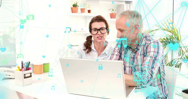 Two globes of digital icons spinning against caucasian senior couple using laptop together at home royalty free illustration