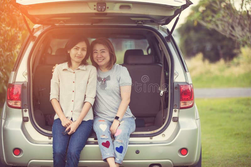 Two Glorious Lesbians Relax On The Car In Park Stock Image Image Of