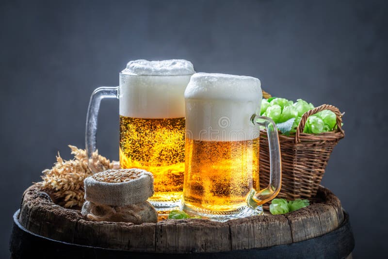 Two Gold Pints of Beer on Old Barrel Stock Image Image of beer