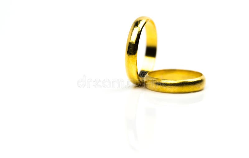 Two Gold Wedding Ring Isolated on White Background with Copy Space
