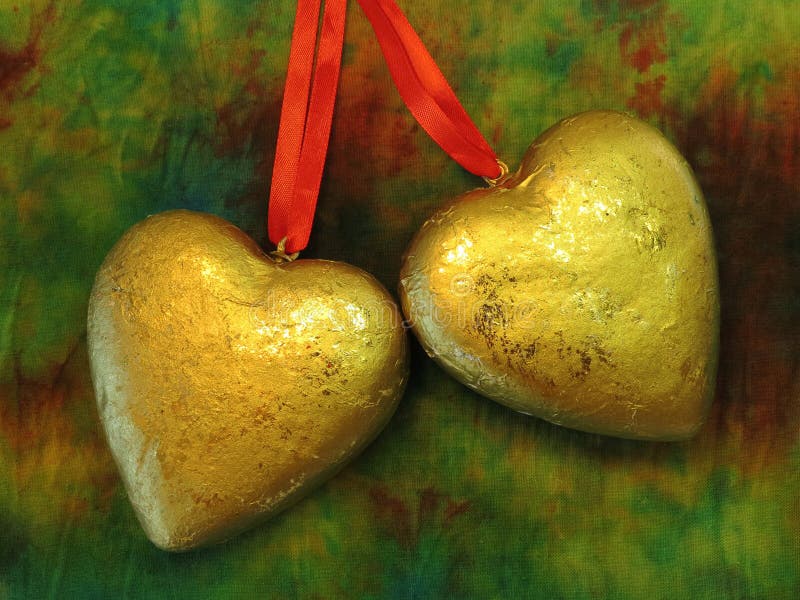 Two golden hearts royalty free stock photo