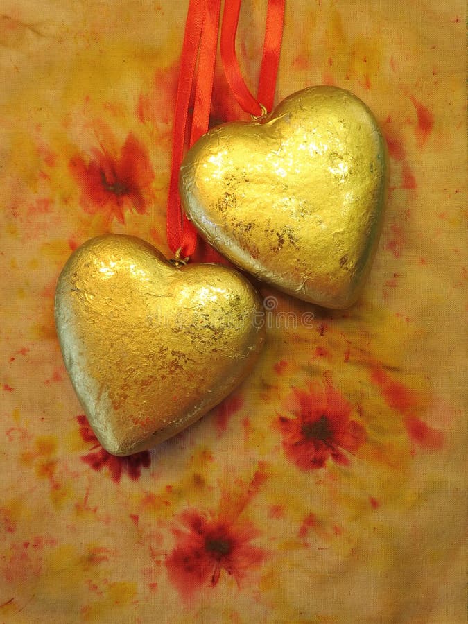 Two golden hearts royalty free stock images