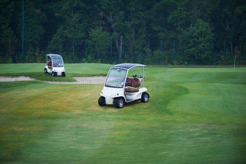 Two golf carts stock image. Image of buggy, competition 99488305