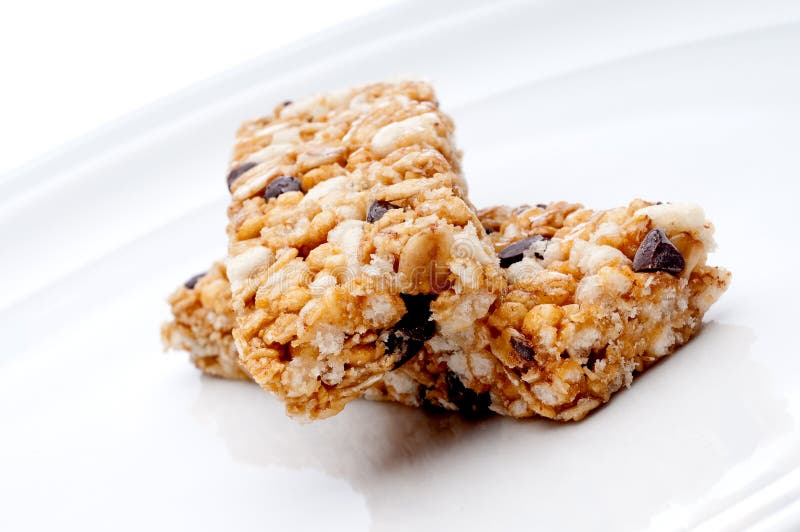 Two granola bars on a white plat