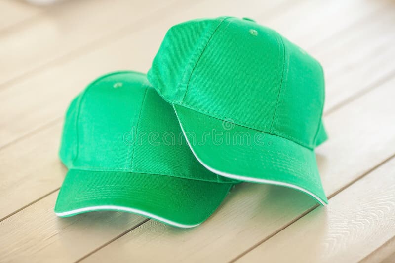 Two green baseball caps. royalty free stock photography