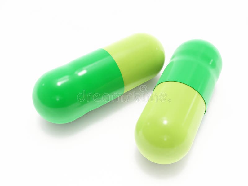 Two green pills on white