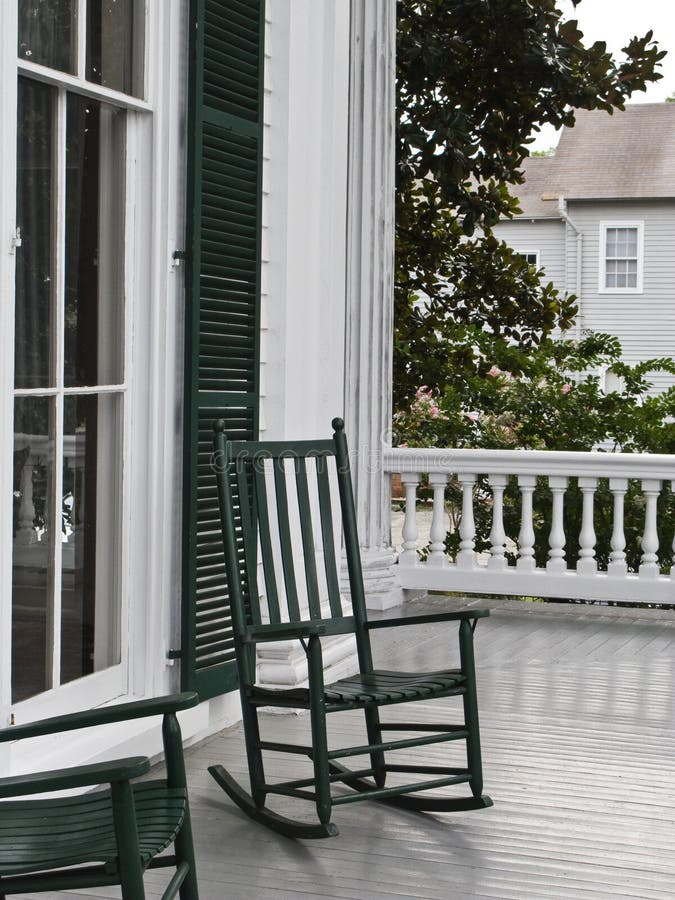 Two green rocking chairs