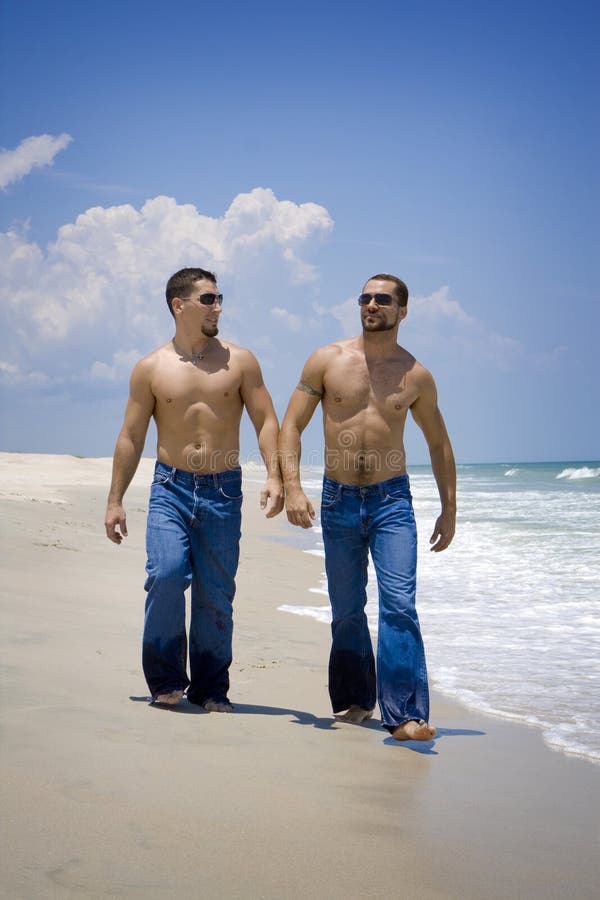 Two guys on beach vacation stock