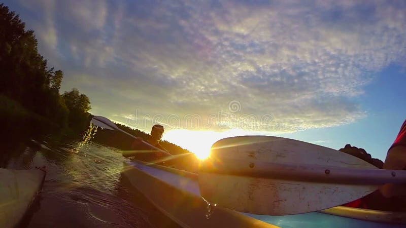 Two guys kayaking at sunset, sport, action camera, traveling