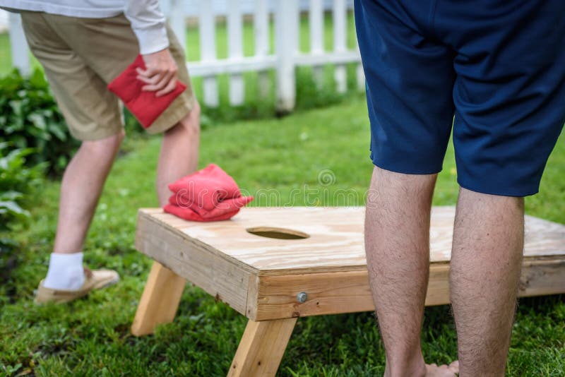 Playing Bags Corn Hole Game in Backyard Stock Image Image of laying