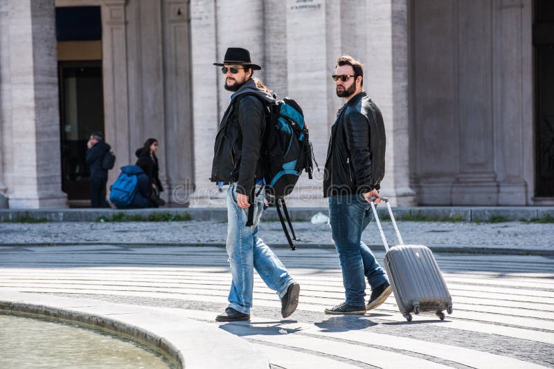 Two Guys are Walking through the Streets of Genova, Italy and Looking ...