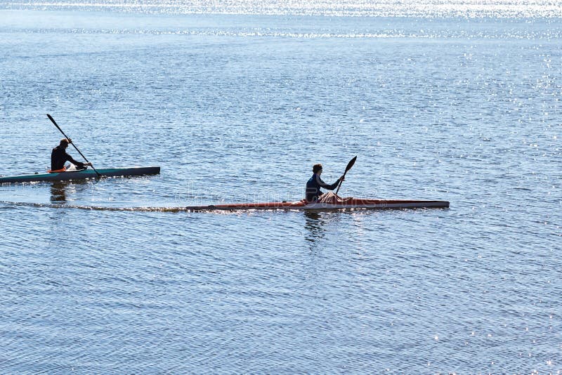 Two Guys in Wetsuits on a Kayak Float Stock Photo Image of river