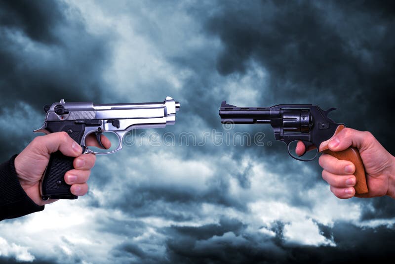 Two hand holding gun revolvers.