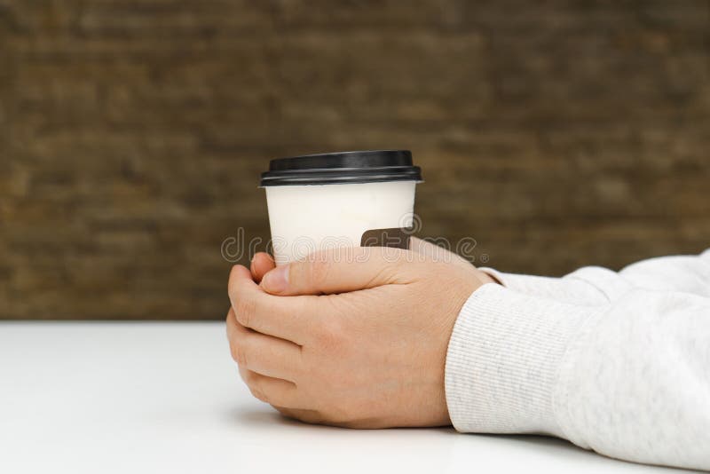 Two Hands Hold Coffee Cup, Warming Hands, Hugging Warm Coffee Mug