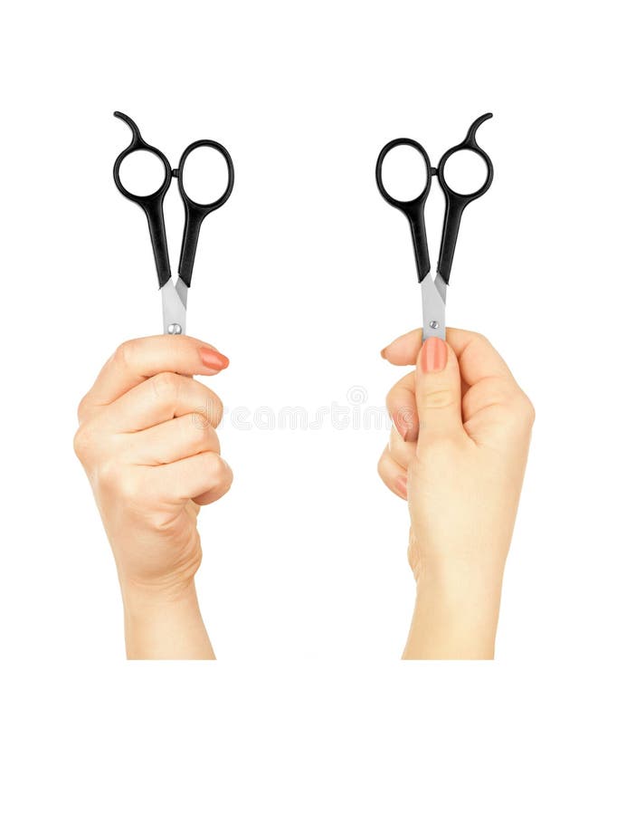 Two hands holding a pair of scissors stock photography