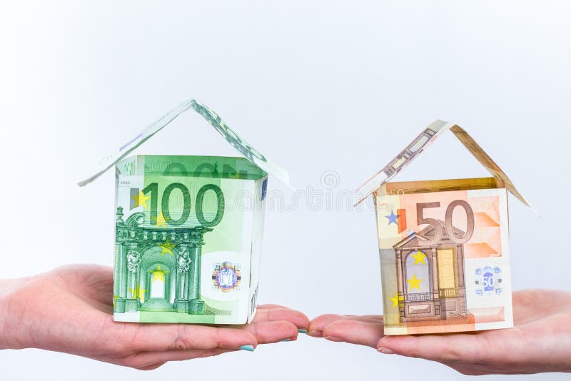 Two hands showing euro bills houses