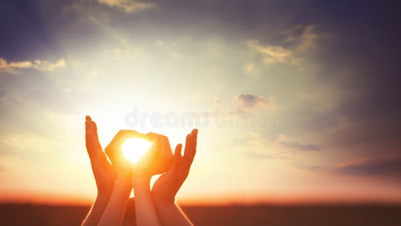 Two hands on sunsut.