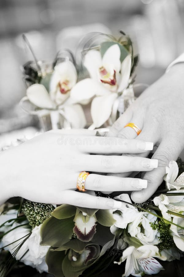 Two hands with wedding rings in balck and white