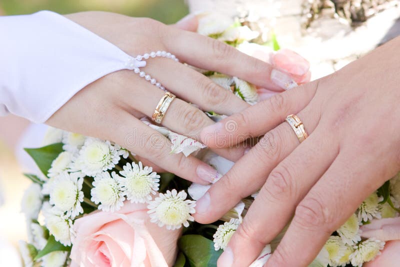 Premium Photo | Two wedding rings in the hands of the newlyweds close up.  wedding ceremony. wedding day