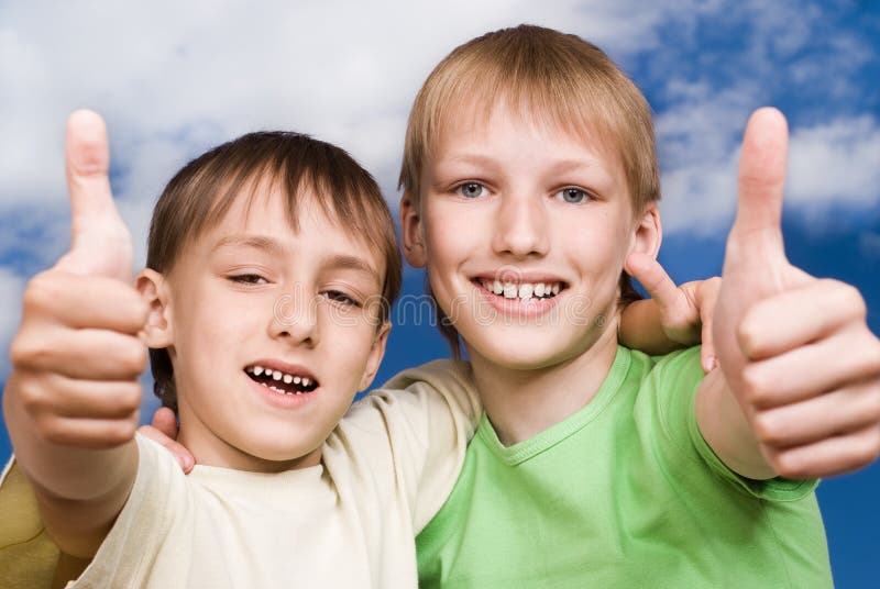 Two happy brothers stand