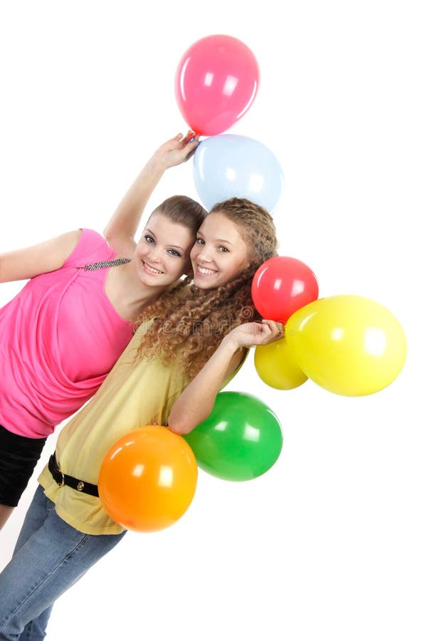 Two happy girls with colorful balloons