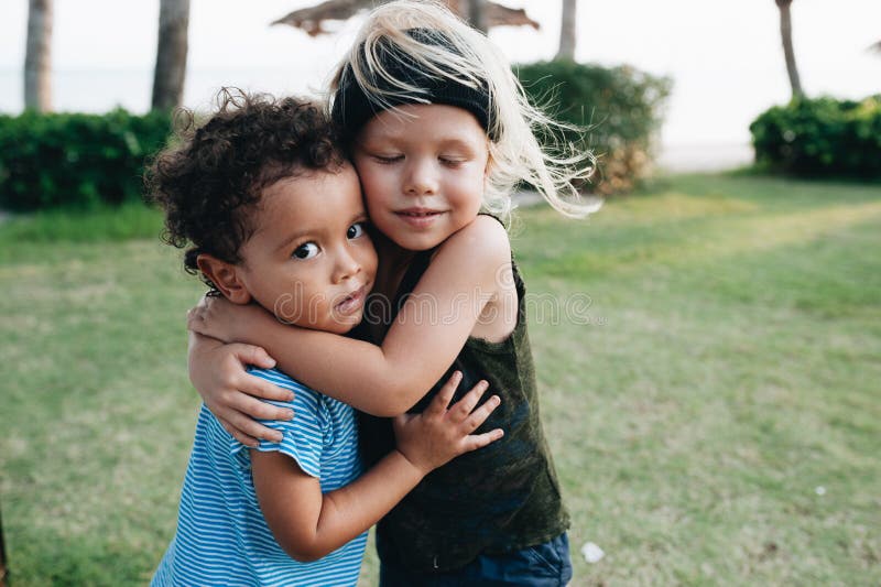 young boys hugging