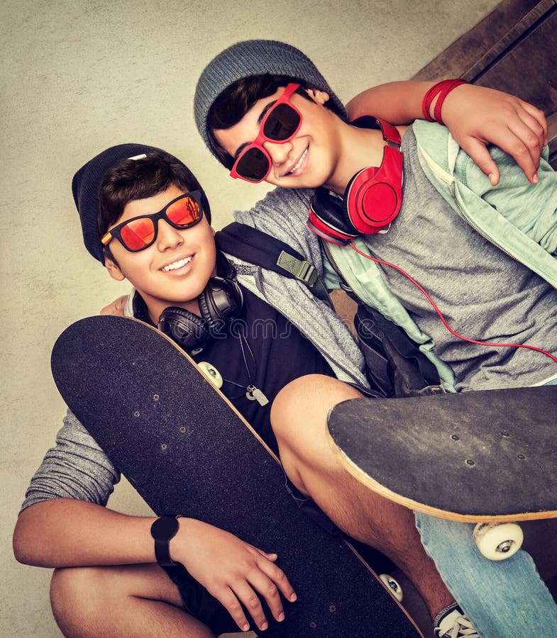 https://thumbs.dreamstime.com/b/two-happy-teen-boys-stylish-sitting-bench-holding-skateboards-cheerful-active-friends-enjoying-outdoors-sport-fashion-56171492.jpg