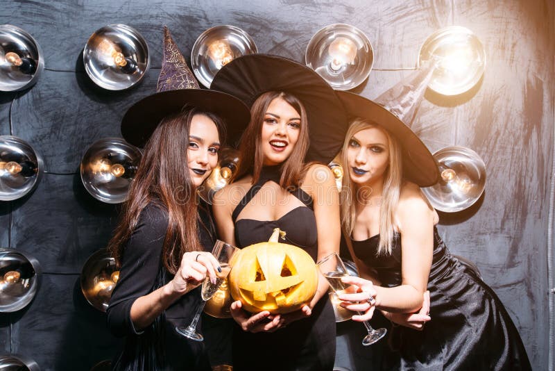 Two Happy Young Women in Black Witch Halloween Costumes on Party Stock ...