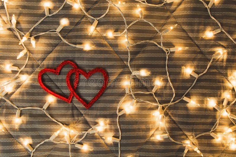 Two hearts with yellow lights, cozy couple concept, Valentine`s Day royalty free stock photo Two hearts with yellow lights, cozy couple concept, Valentine`s Day royalty free stock photo