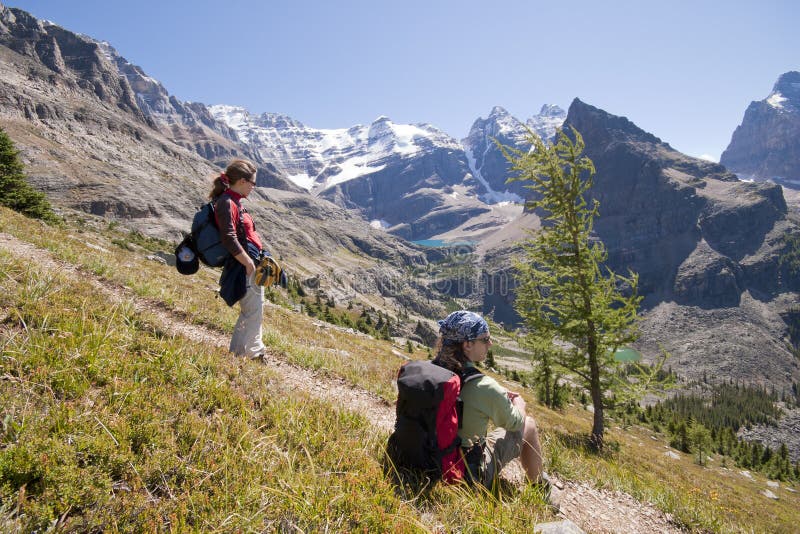Two hikers in canadian rockies stock image