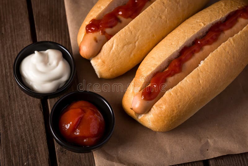 Two hot dogs with ketchup stock photo. Image of nutrition 92671442