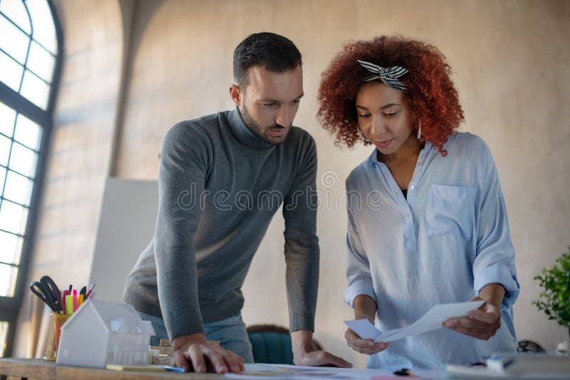 Two interior designers discussing new project stock photo