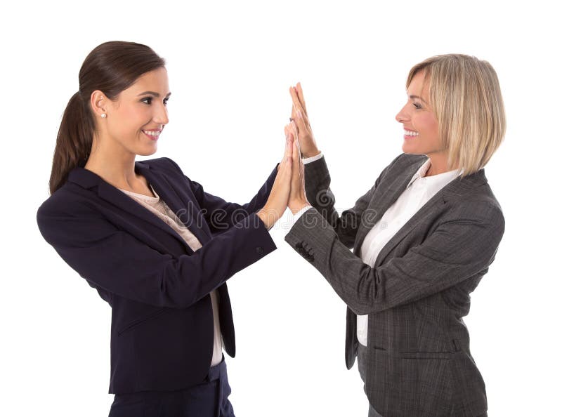 Two isolated business woman making handshake. Two isolated business women making handshake over white background royalty free stock photos Two isolated business woman making handshake. Two isolated business women making handshake over white background royalty free stock photos