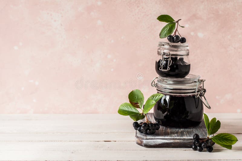 A Stack of Two Jars of Chokeberry Jam, copy space for your text