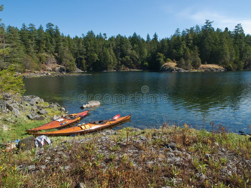 Two kayaks on rocky shore