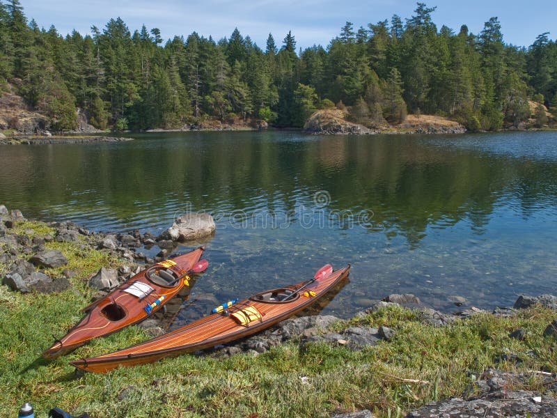 Two kayaks on rocky shore