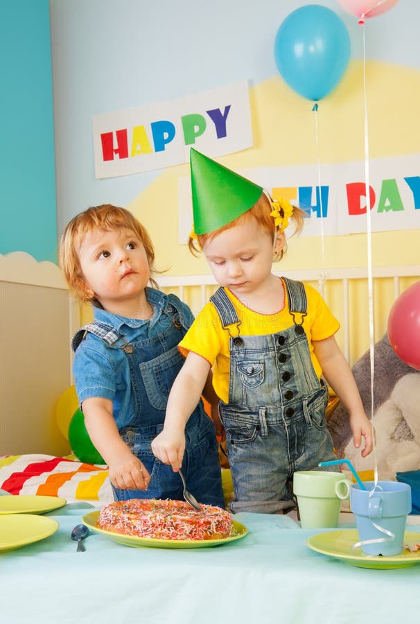 Two Kids Eating Cake On The Birthday Party Stock Photo - Image of girl